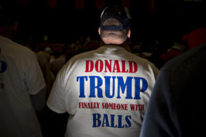 An attendee wears a campaign t-shirt for Donald Trump, president and chief executive of Trump Organization Inc. and 2016 Republican presidential candidate, during a Trump campaign rally at the Radford University Dedmon Arena in Radford, Virginia, U.S., on Monday, Feb. 29, 2016. The single biggest day of voting in the Republican primary is March 1, Super Tuesday, when nearly half of the delegates needed to secure the nomination are up for grabs with Trump favored in most of these contests. Photographer: Andrew Harrer/Bloomberg via Getty Images
